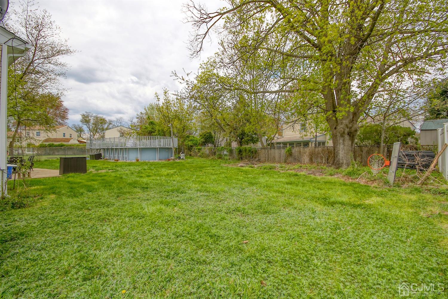 19 Sulliman Road Edison, NJ 08817 - Photo 22 of 22 a backyard of a house with lots of green space