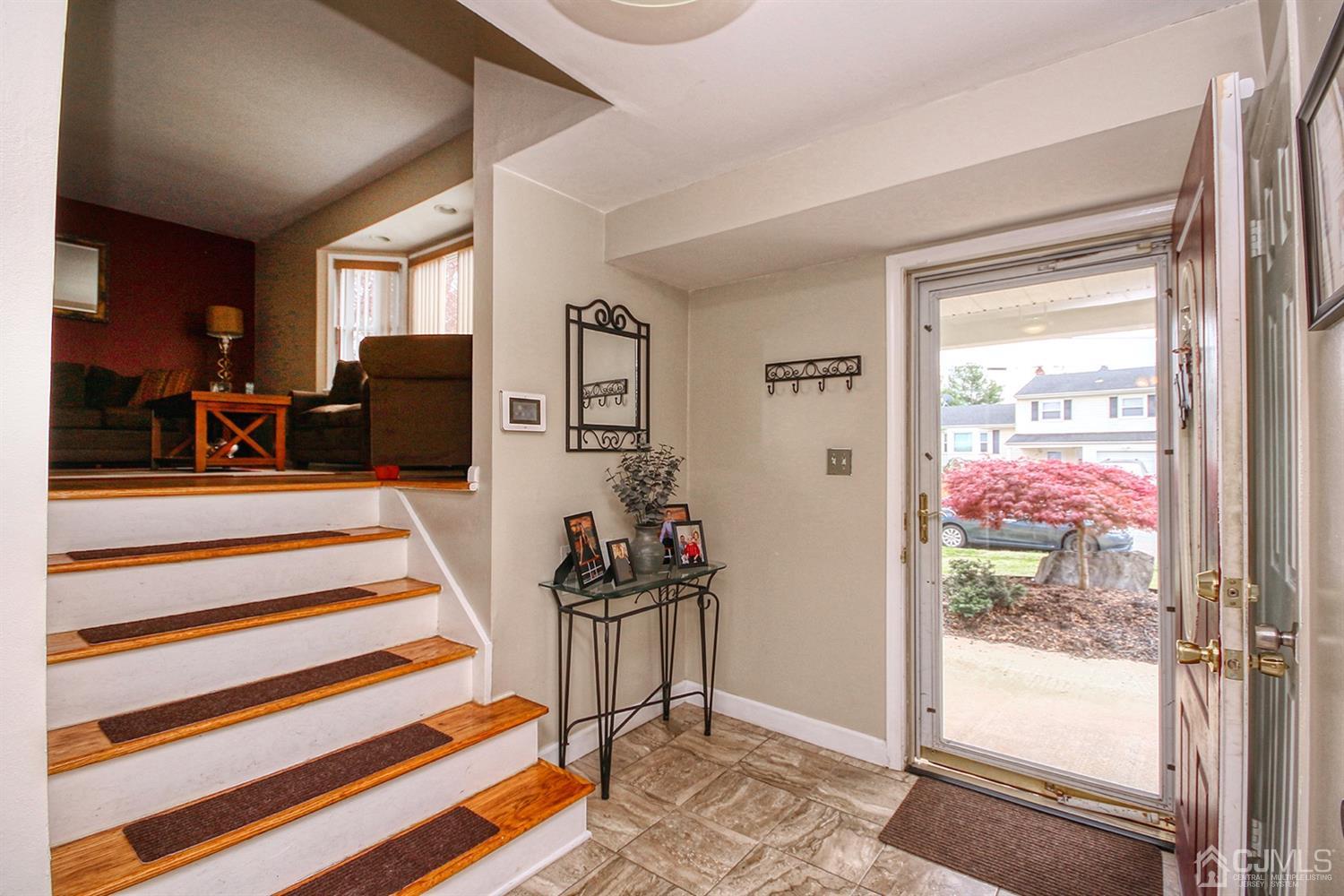 19 Sulliman Road Edison, NJ 08817 - Photo 4 of 22 a view of a livingroom with furniture and front door