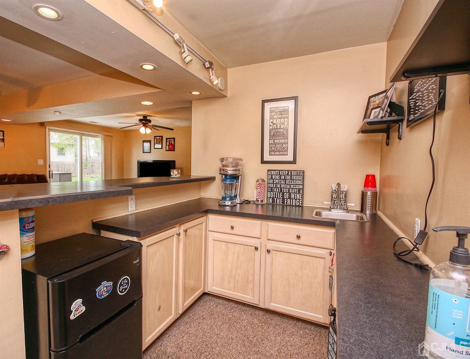 19 Sulliman Road Edison, NJ 08817 - Photo 7 of 22 a kitchen with a sink and cabinets