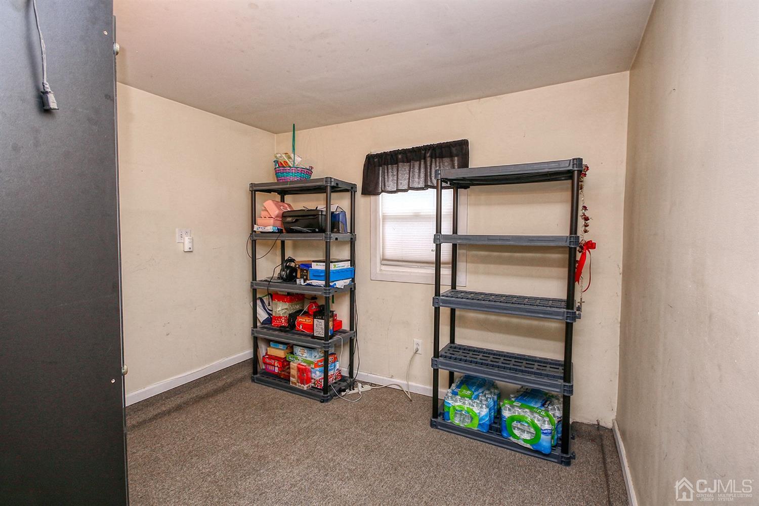 19 Sulliman Road Edison, NJ 08817 - Photo 8 of 22 a room with storage and a white walls