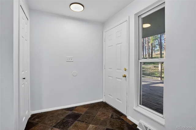 a view of kitchen with wooden floor