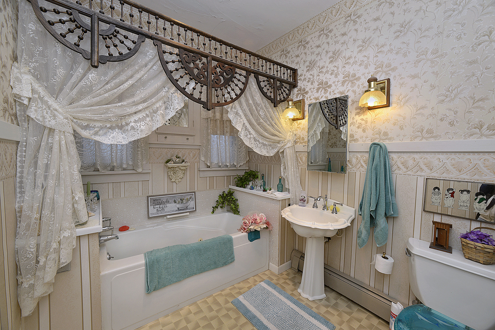 221 East Grove Street Utica, IL 61373 - Photo 12 of 27 a bathroom with a sink mirror and toilet