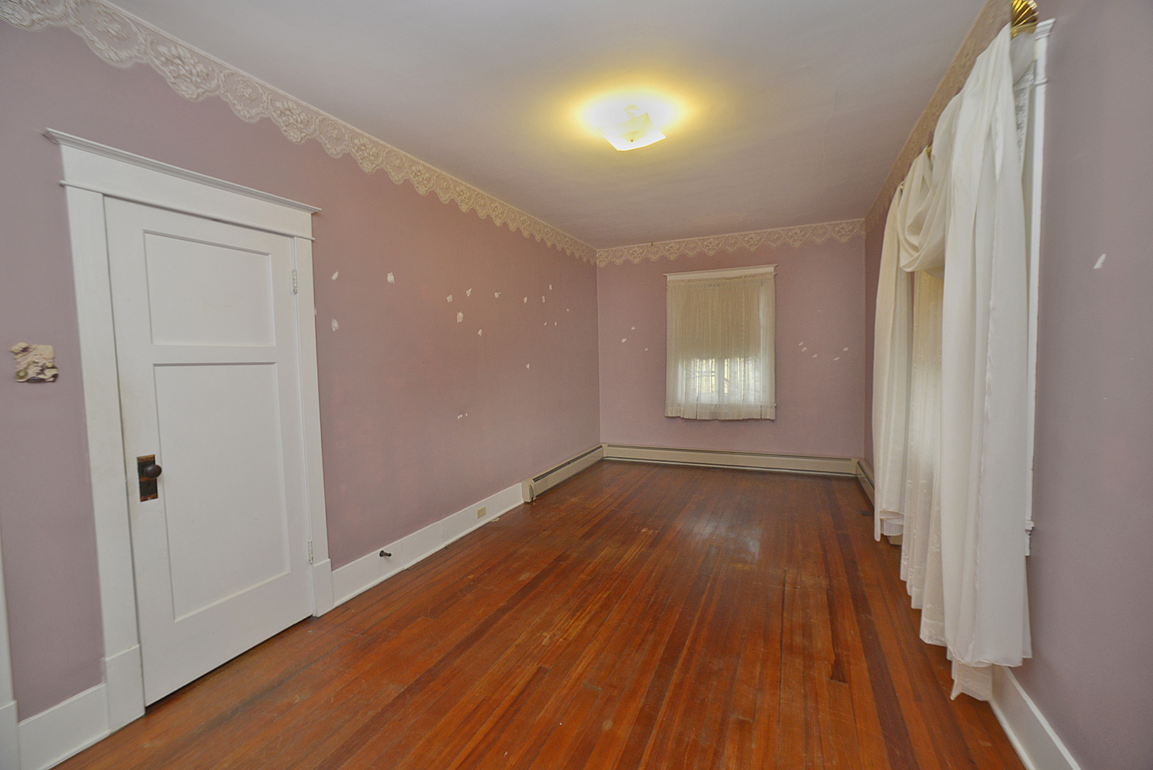 221 East Grove Street Utica, IL 61373 - Photo 13 of 27 wooden floor in an empty room with a window