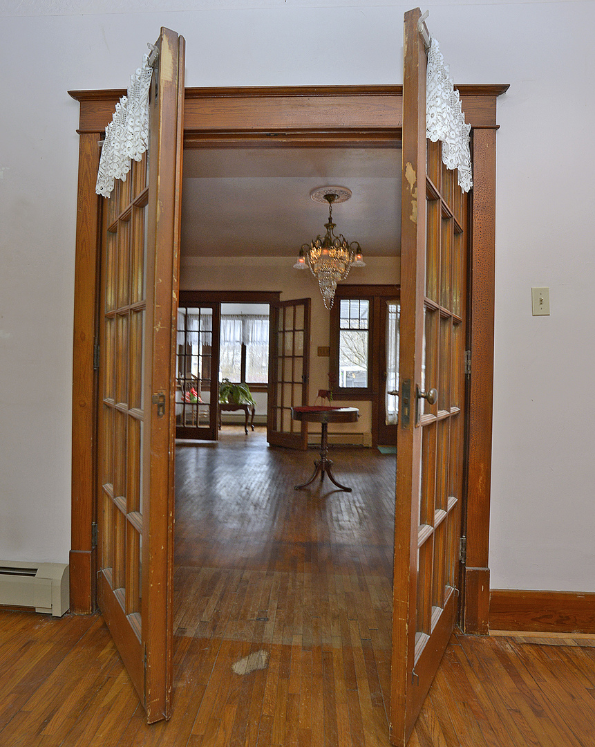221 East Grove Street Utica, IL 61373 - Photo 4 of 27 a view of living room with furniture and wooden floor