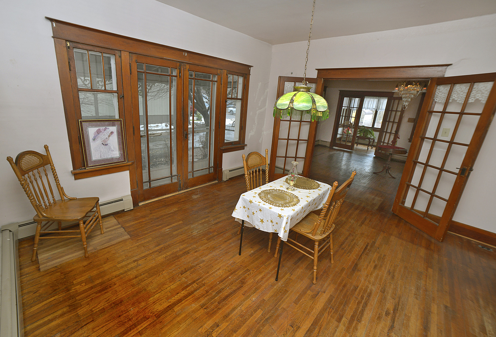 221 East Grove Street Utica, IL 61373 - Photo 5 of 27 a view of a livingroom with furniture wooden floor and windows