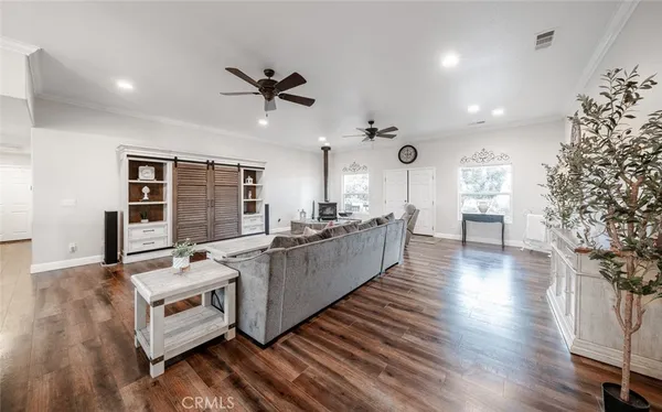 a view of a dining room with furniture wooden floor and a chandelier