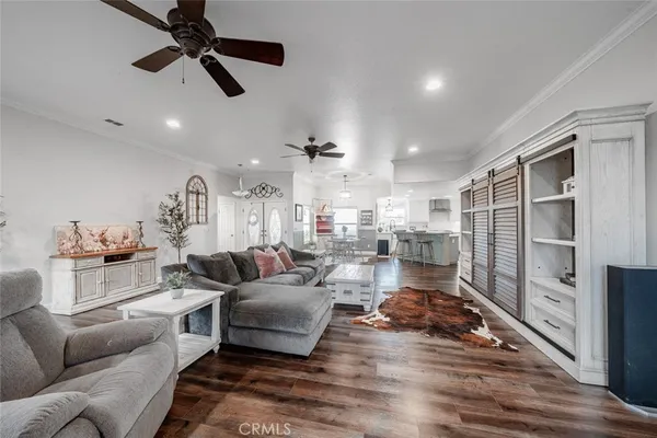 a kitchen with stainless steel appliances white cabinets and a stove top oven