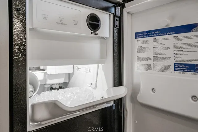 a bedroom with a bed window and a chair