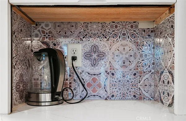 a bedroom with a bed window and a chair