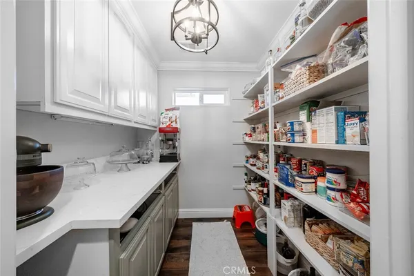 a view of walk in closet with clothes