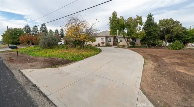 a view of a street with a building in the background