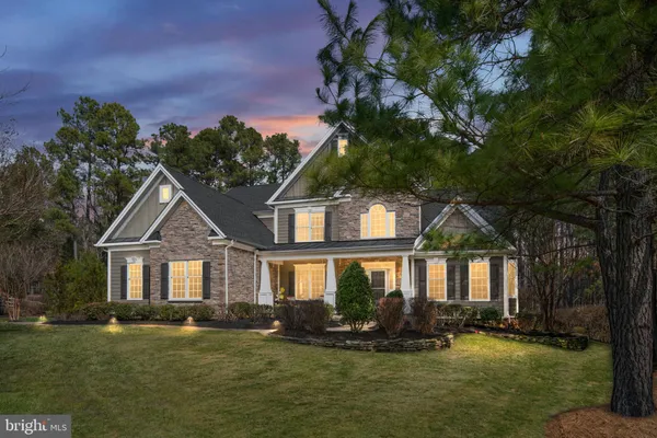 an aerial view of a house with swimming pool lake view and mountain view