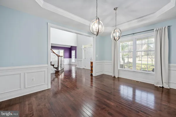 a spacious bedroom with a bed and a window