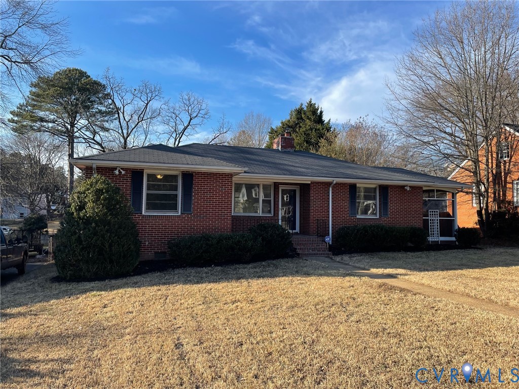 1310 Forest Avenue Henrico, VA 23229 - Photo 1 of 6 a front view of a house with a yard covered in snow