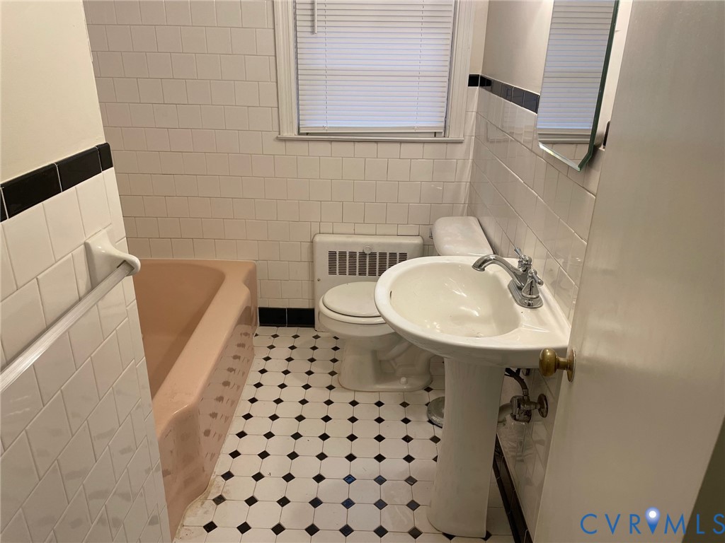 1310 Forest Avenue Henrico, VA 23229 - Photo 5 of 6 a bathroom with a sink a toilet and shower
