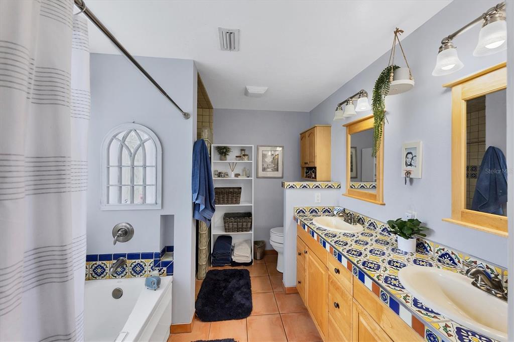 7192 North Paragon Road North Port, FL 34291 - Photo 20 of 40 a spacious bathroom with a tub sink and mirror