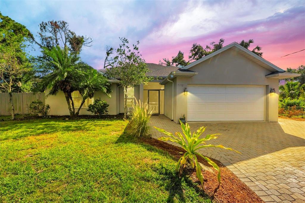 7192 North Paragon Road North Port, FL 34291 - Photo 2 of 40 a view of a house with a yard