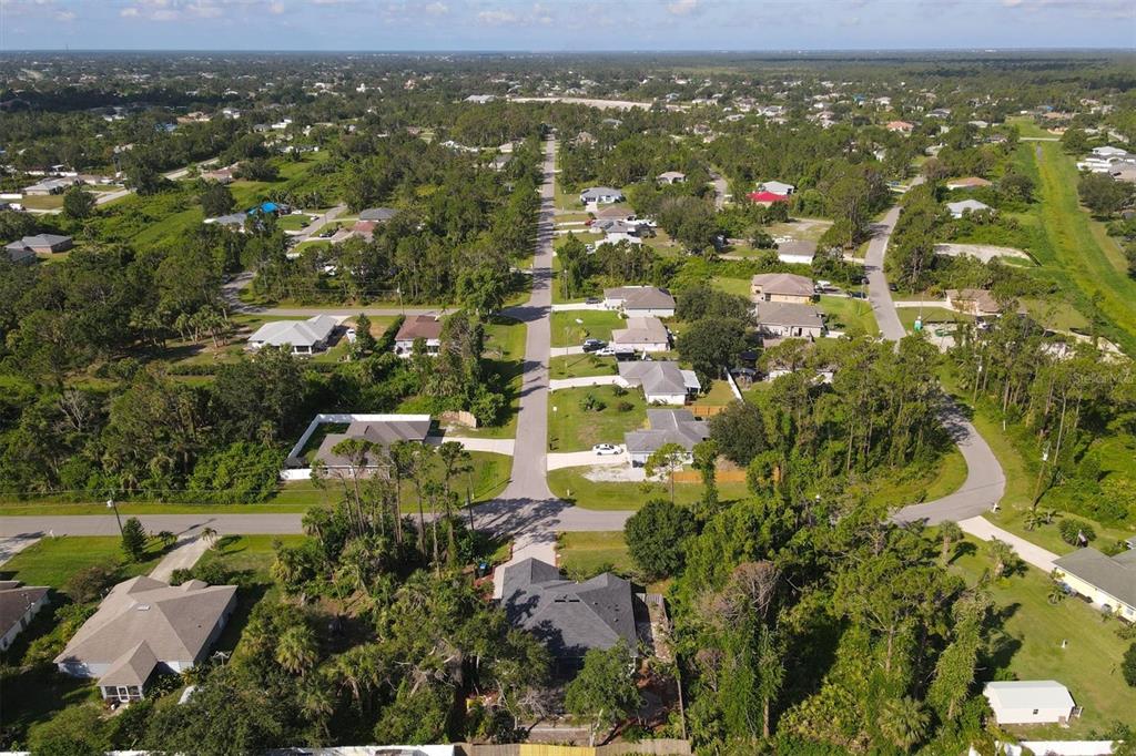 7192 North Paragon Road North Port, FL 34291 - Photo 40 of 40 an aerial view of residential houses with outdoor space and trees