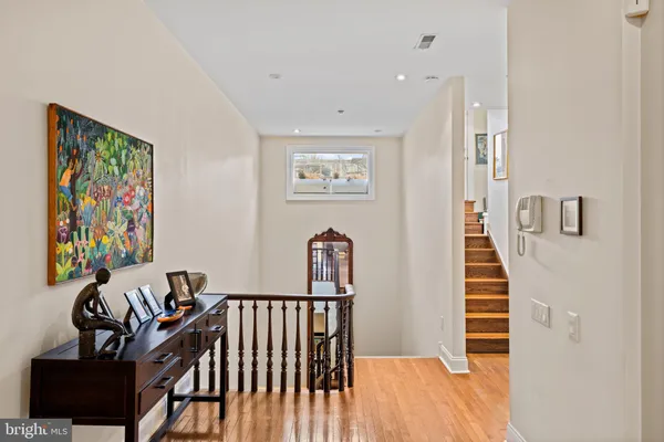 a view of a hallway with workspace