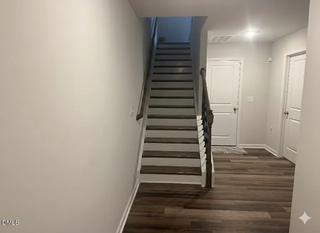 a view of entryway with wooden floor