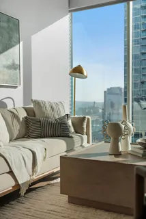 a living room with furniture and a window