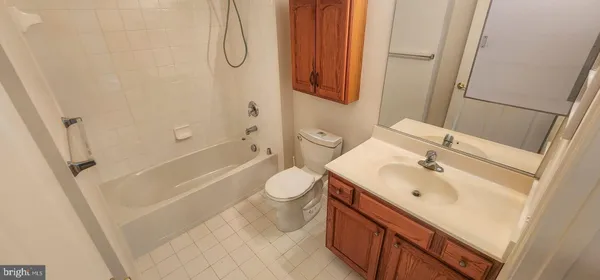 a view of balcony with wooden floor and fence