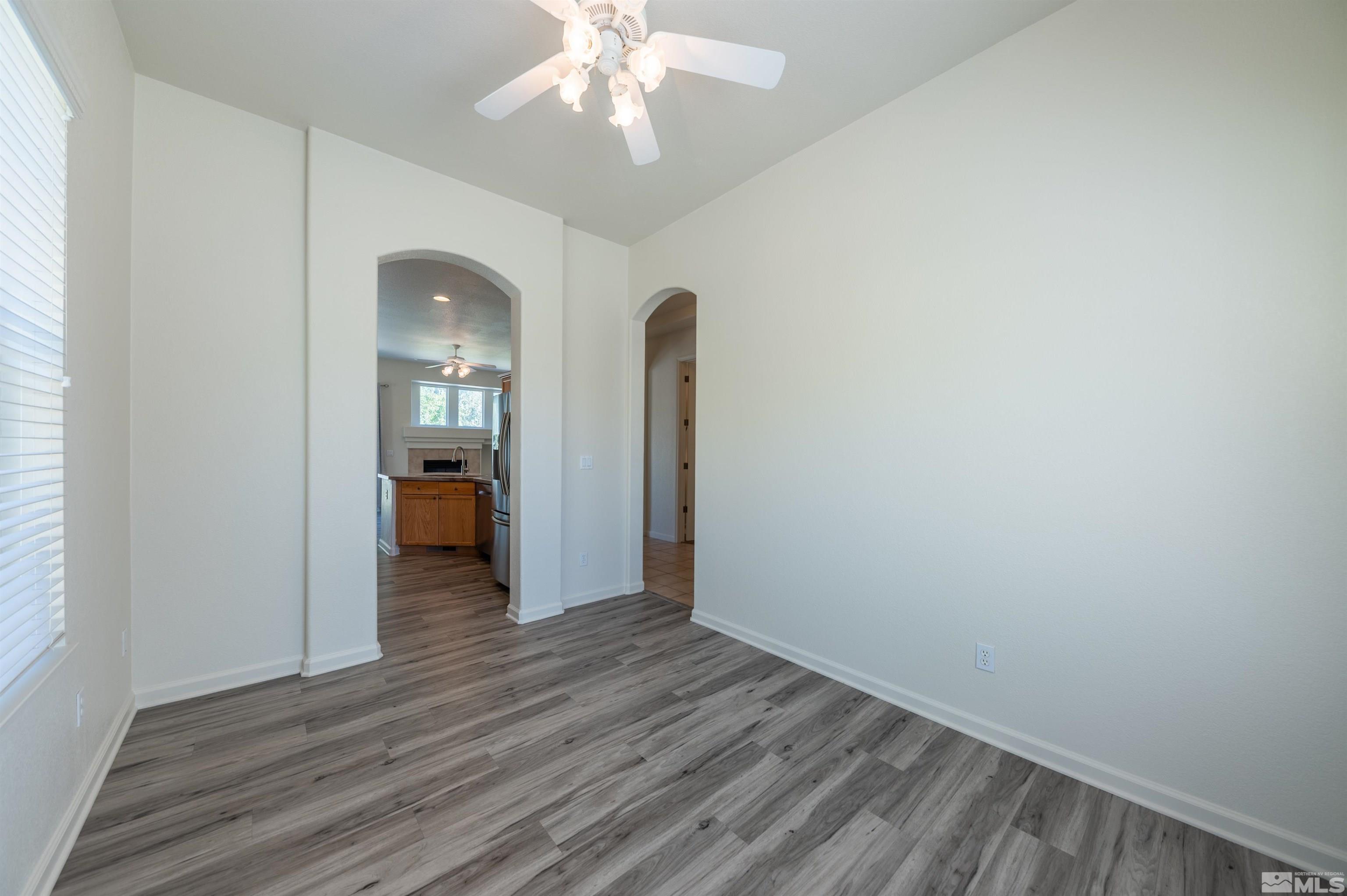 1462 Wessex Circle Reno, NV 89503 - Photo 14 of 40 wooden floor in an empty room with a mirror