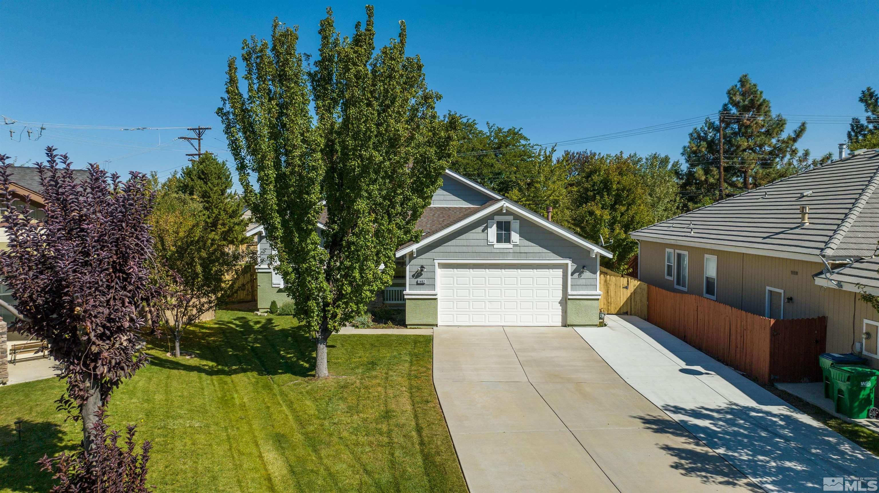 1462 Wessex Circle Reno, NV 89503 - Photo 2 of 40 a view of a house with a yard and large tree