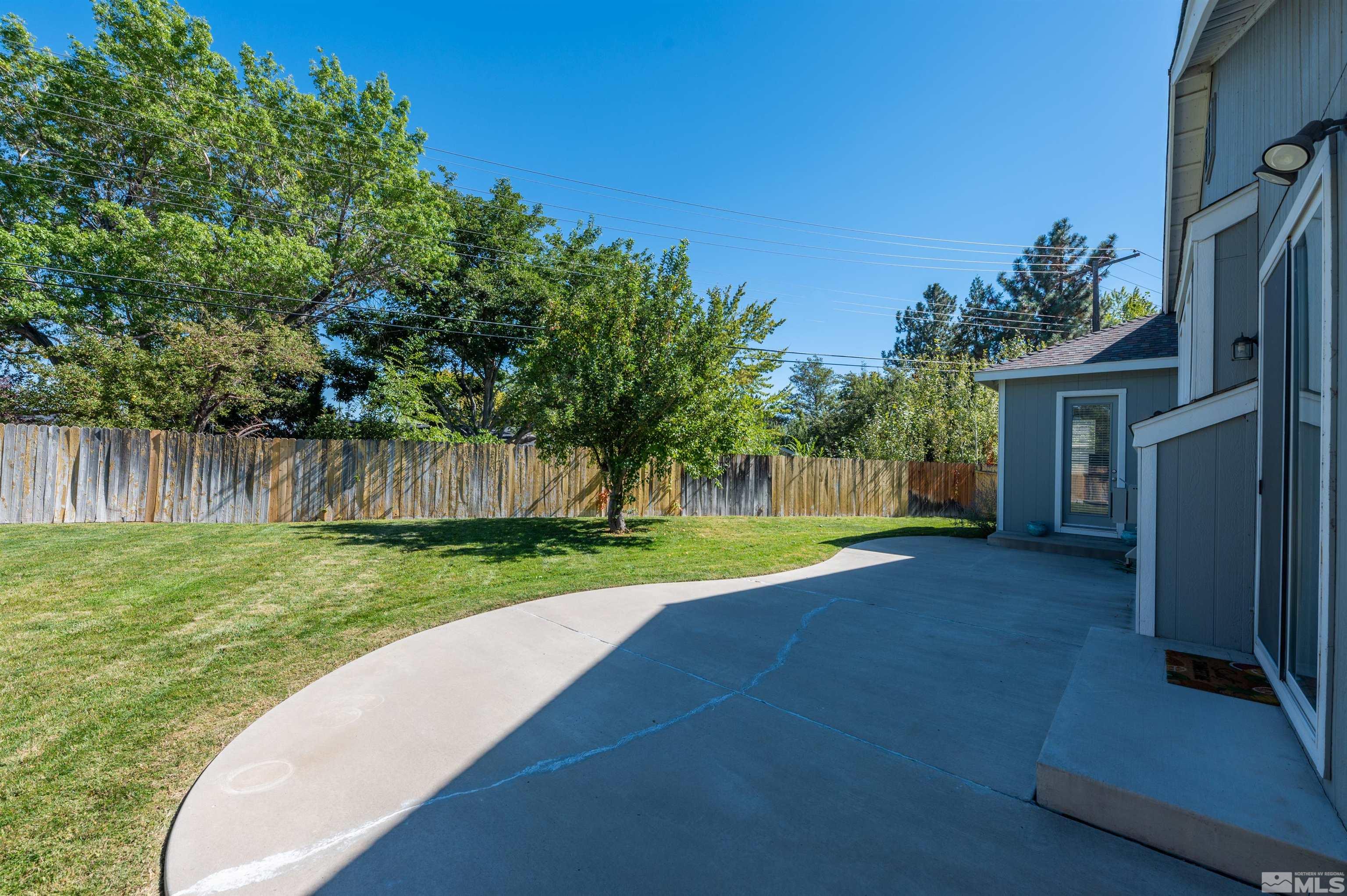 1462 Wessex Circle Reno, NV 89503 - Photo 23 of 40 a view of a house with backyard and a tree