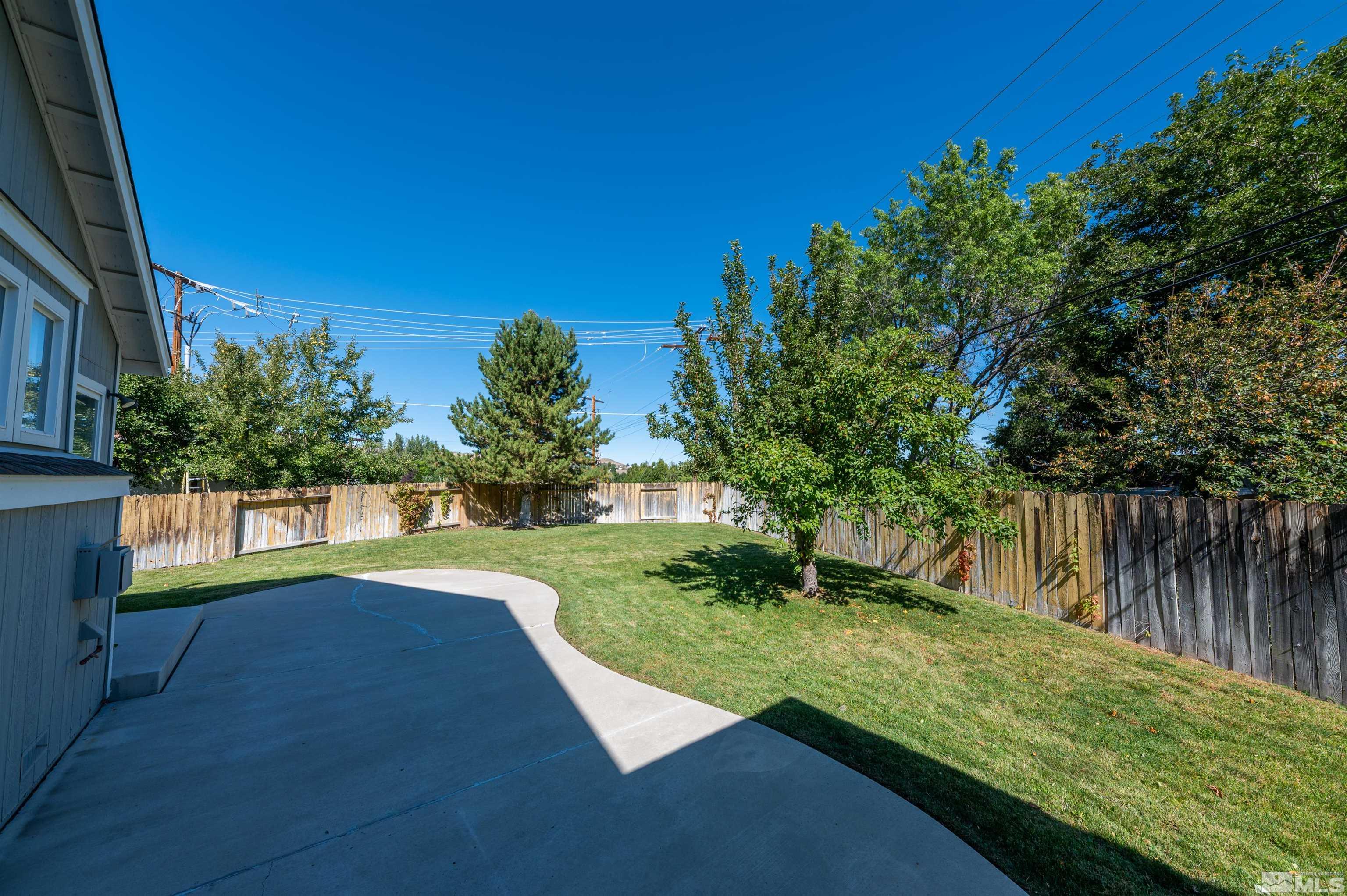 1462 Wessex Circle Reno, NV 89503 - Photo 28 of 40 a view of backyard with swimming pool and green space