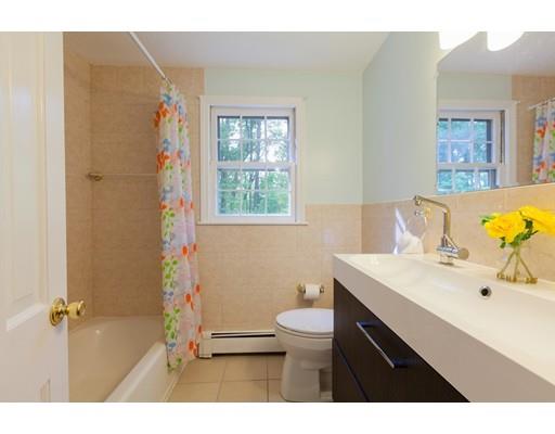 59 Rambling Road Sudbury, MA 01776 - Photo 12 of 24 a bathroom with a sink mirror and a toilet