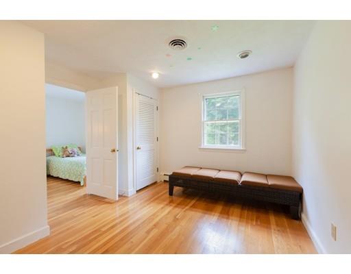 59 Rambling Road Sudbury, MA 01776 - Photo 14 of 24 a living room with a bed furniture and a window