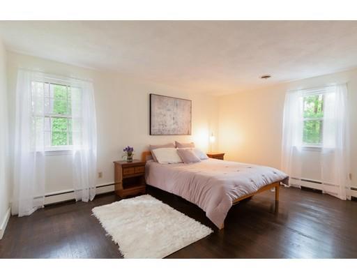 59 Rambling Road Sudbury, MA 01776 - Photo 15 of 24 a bedroom with a bed and wooden floor