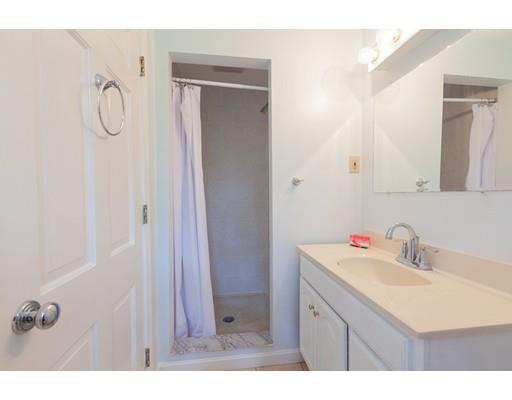 59 Rambling Road Sudbury, MA 01776 - Photo 17 of 24 a bathroom with a sink vanity and a mirror