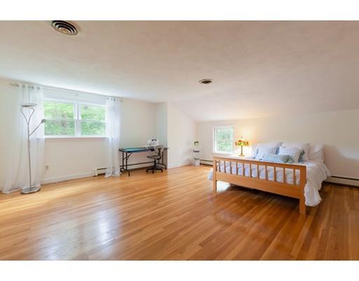 59 Rambling Road Sudbury, MA 01776 - Photo 19 of 24 a view of a livingroom with wooden floor and furniture