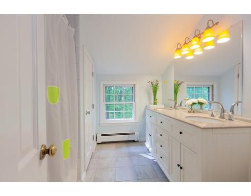 59 Rambling Road Sudbury, MA 01776 - Photo 20 of 24 a bathroom with a sink mirror and a bathtub