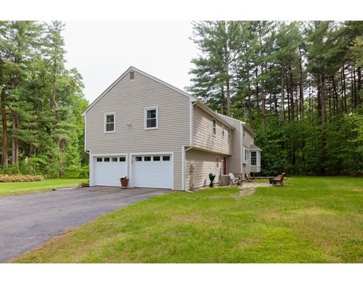 59 Rambling Road Sudbury, MA 01776 - Photo 23 of 24 a view of a house with a yard and sitting area