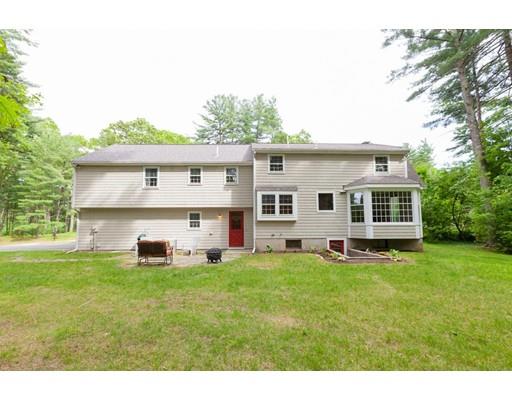 59 Rambling Road Sudbury, MA 01776 - Photo 24 of 24 a view of a house with a big yard and large trees