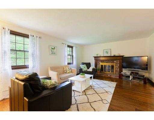 59 Rambling Road Sudbury, MA 01776 - Photo 4 of 24 a living room with furniture and a flat screen tv