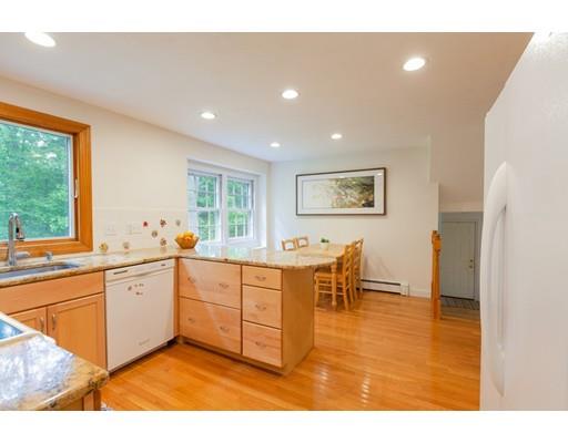 59 Rambling Road Sudbury, MA 01776 - Photo 7 of 24 a large white kitchen with wooden floor