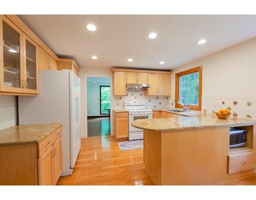 59 Rambling Road Sudbury, MA 01776 - Photo 9 of 24 a kitchen with stainless steel appliances granite countertop a sink and a refrigerator