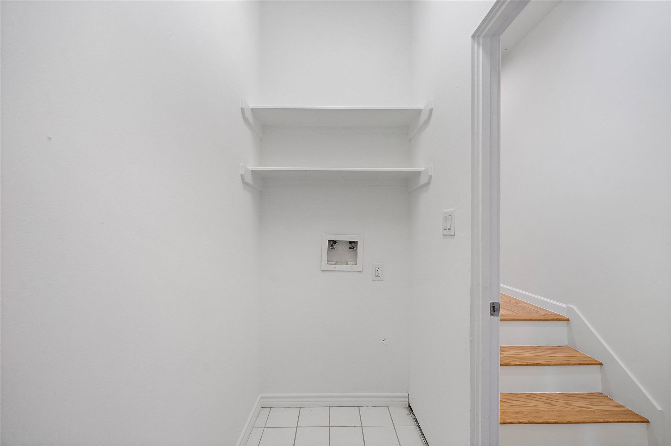 2437 North Boulevard Houston, TX 77098 - Photo 15 of 32 a view of staircase with white walls and white door