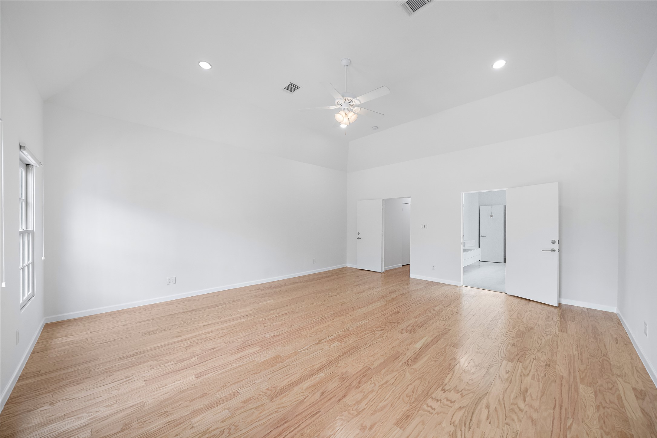 2437 North Boulevard Houston, TX 77098 - Photo 17 of 32 a view of empty room with wooden floor and ceiling fan