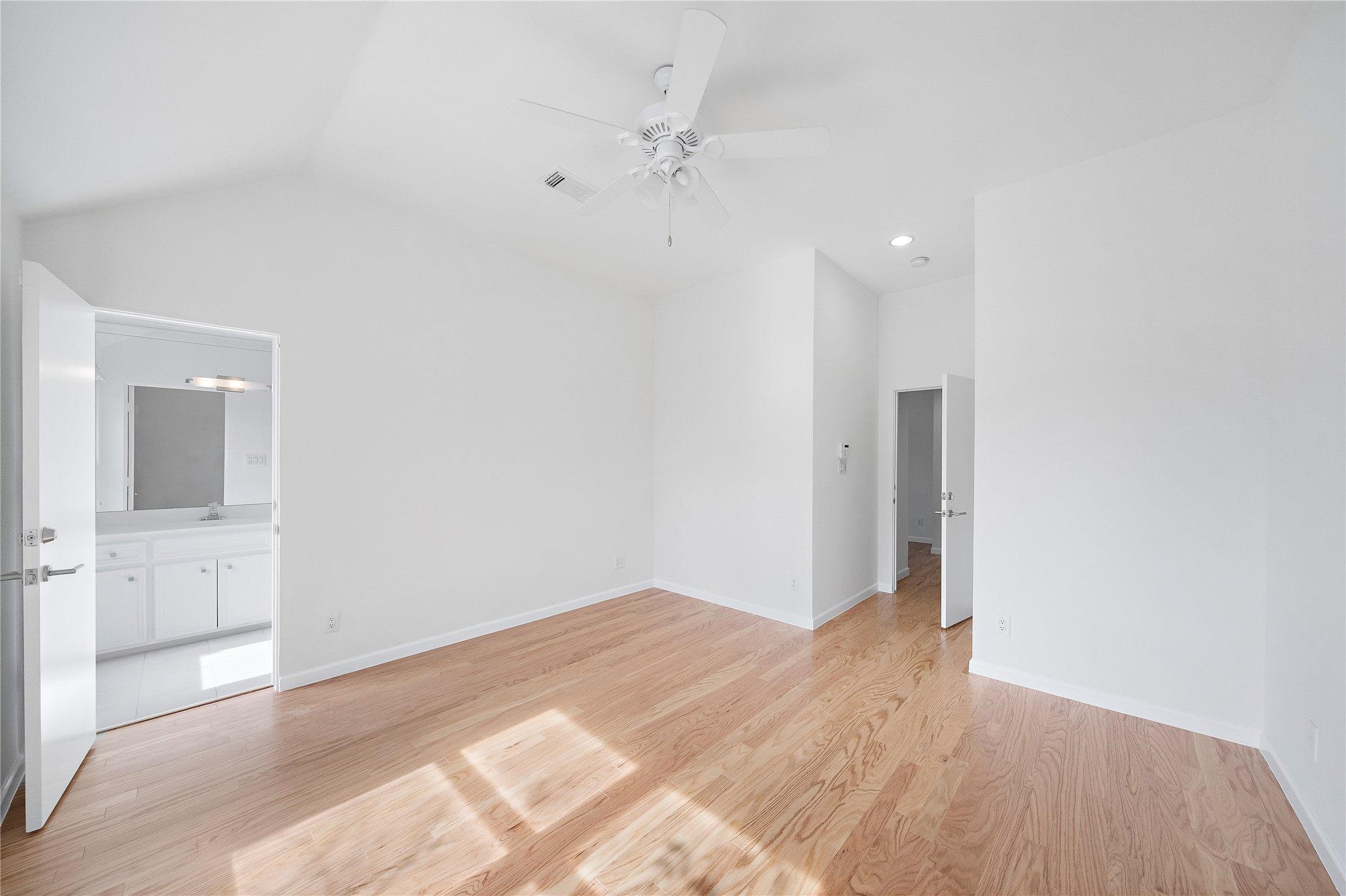 2437 North Boulevard Houston, TX 77098 - Photo 26 of 32 a view of a big room with wooden floor and a ceiling fan