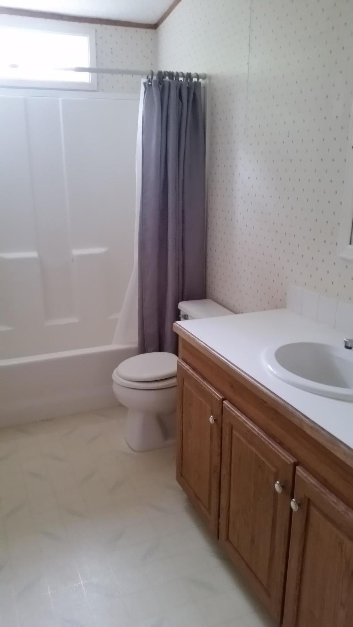 511 Donet Lane Merlin, OR 97532 - Photo 9 of 29 a bathroom with a sink a toilet and shower