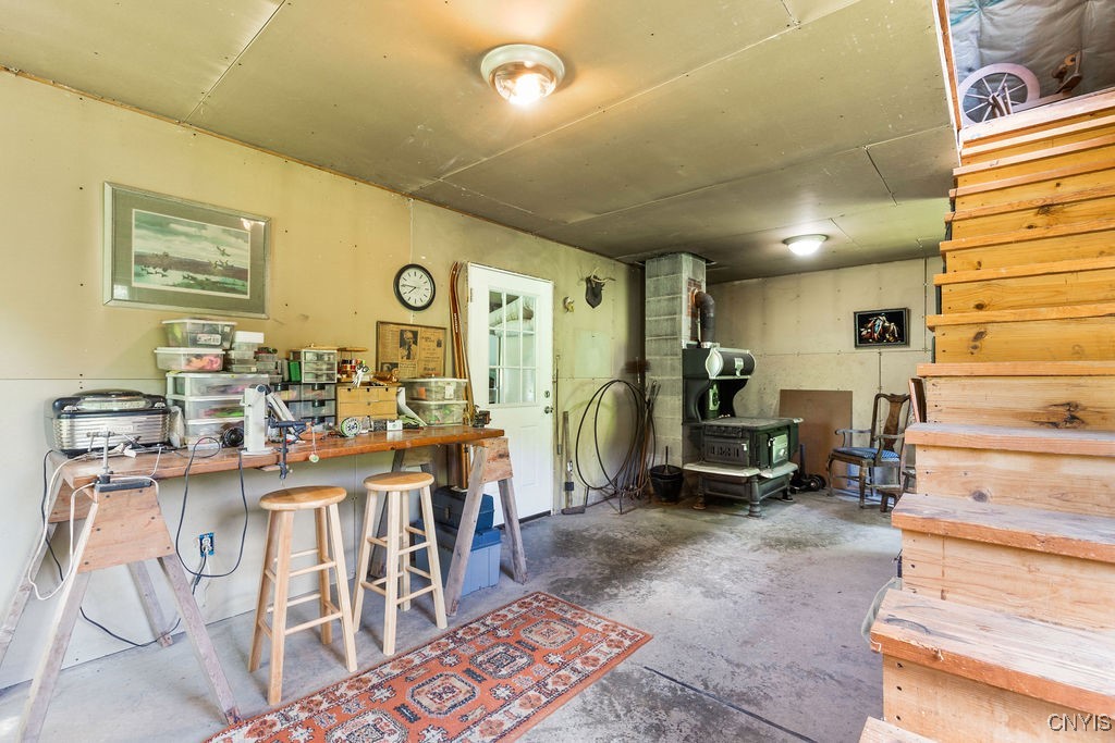 1739 Cardner Road Fabius, NY 13122 - Photo 46 of 50 Garage work space and stairs to 2nd floor.