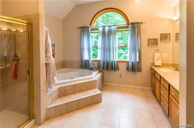 a bathroom with a bathtub and shower