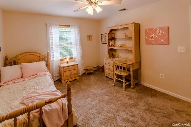 a spacious bedroom with a bed and a window