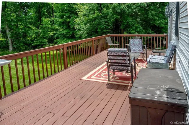 a view of a patio with wooden floor