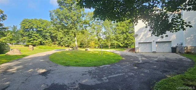 a view of outdoor space with deck and yard